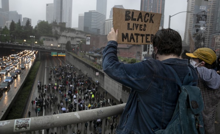 Protests over police killings rage in dozens of US cities